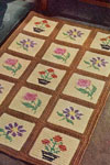 cream and brown embroidered block rug pattern