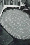 The Gray and White Oval Rug